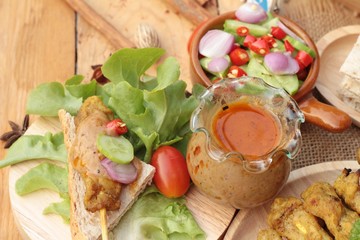 Pork satay,grilled pork with peanut sauce .