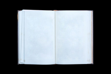 Old open book isolated on black background