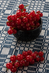 red currant in black bowl