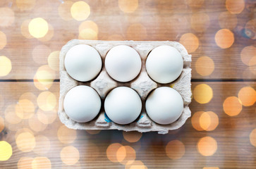 close up of white eggs in egg box or carton
