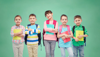 happy children with school bags and notebooks