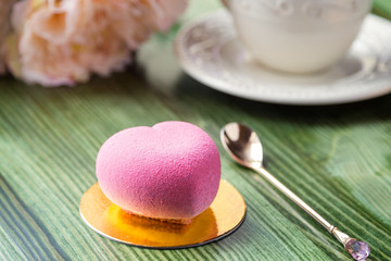 French mousse cake in pink chocolate velour