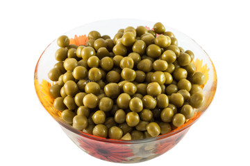 Green peas in a dish on a white background