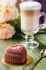 French heart shaped mousse cake covered with chocolate velour