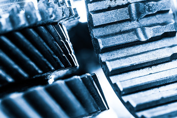 Gears, grunge cogwheels, real engine elements close-up. Heavy industry