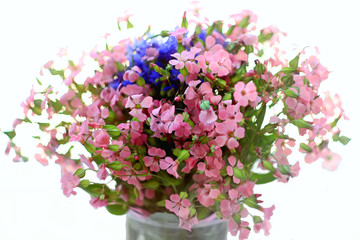 Naklejka na ściany i meble bouquet of wild flowers pink and blue on a white background