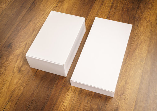 Blank white box mock up on wood background