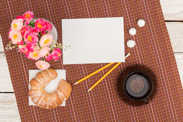 croissant, tea and flowers