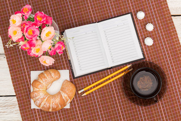 croissant, tea and flowers