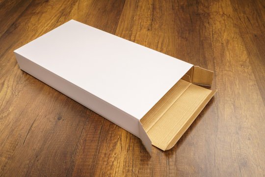 Blank white box mock up on wood background