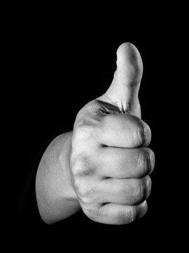 Male hand sign with thumb up. Isolated concept