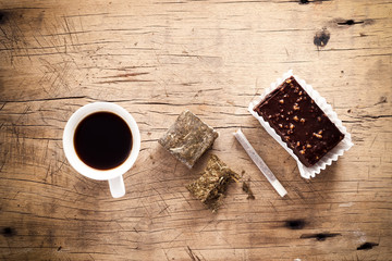 weed marijuana hashish roll wood background