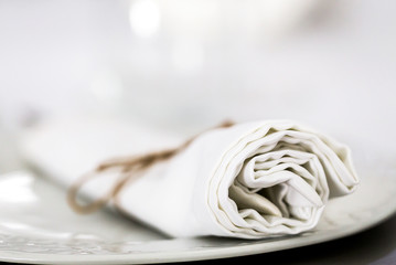 White folded napkin on a plate