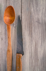 Old wooden spoon and kitchen knife