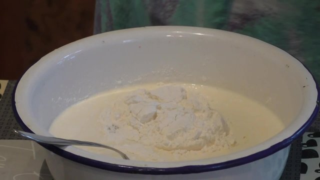The woman knead the dough for a pie