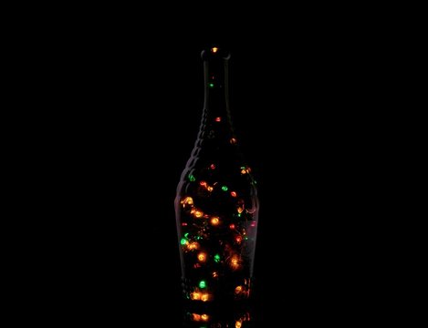 Bottle in the light of a garland