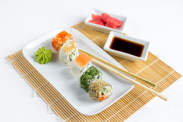 Sushi set on white wooden background