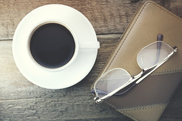 coffee and glasses on notebook