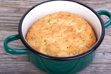 Biscuit, cake in shape for baking, saucepan
