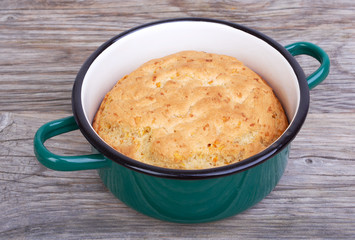 Biscuit, cake in shape for baking, saucepan
