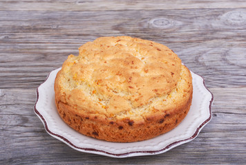 Biscuit, cake on plate on a wooden