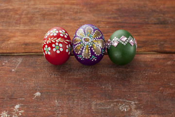 Colorful easter eggs on wooden board