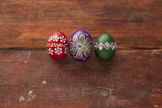 Colorful easter eggs on wooden board