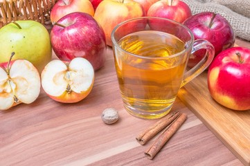 Apple juice. Drink on wooden table.