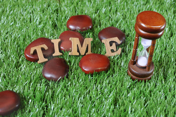 Sand-glass and wooden alphabet, Time management concept and in time idea