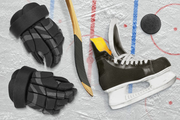 Hockey skates, gloves, stick and puck