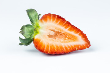 Half of strawberry isolated on white background