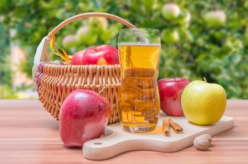 Apple juice - beverage on wooden table.