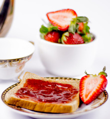 sweet strawberries jam on toast close up