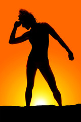 Fototapeta na wymiar silhouette of a woman stand hand on head look down