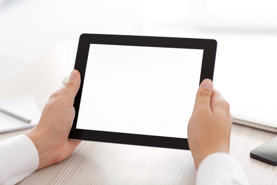 male hands holding a tablet with isolated screen