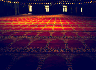 mosque interior with carpet and lights