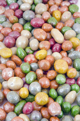 Multicolored glazed raisins background