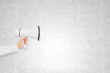 Hand with a loudspeaker