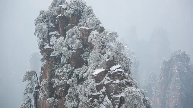 winter time famous chinese snowy mountain park zhangjiajie full hd panorama china
