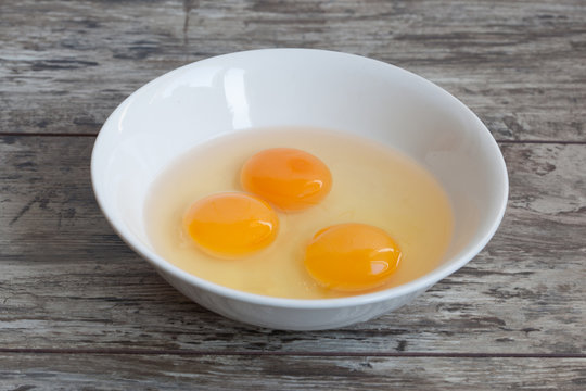 Three raw egg yolk on the plate