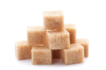 Cubes of cane sugar isolated on white background