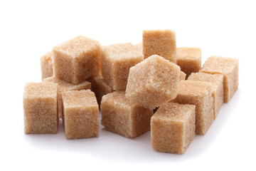 Cubes of cane sugar isolated on white background
