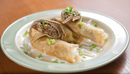 pancakes with the liver on wooden table
