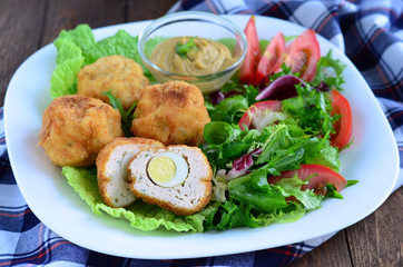 Scotch eggs and salad