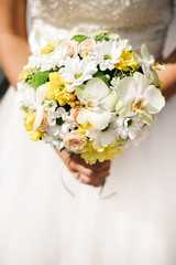 Bride bouquet with white roses, orchids, daisies