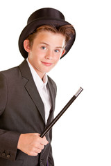 Cute young boy dressed as a magician