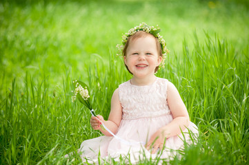 funny baby girl outdoors, child smiling