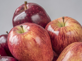 pile of red delicious apples with water drops