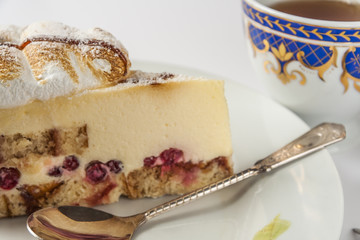 Cake On Saucer With Spoon And Cup Of Tea