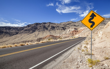 Picture of a winding road ahead sign, USA.